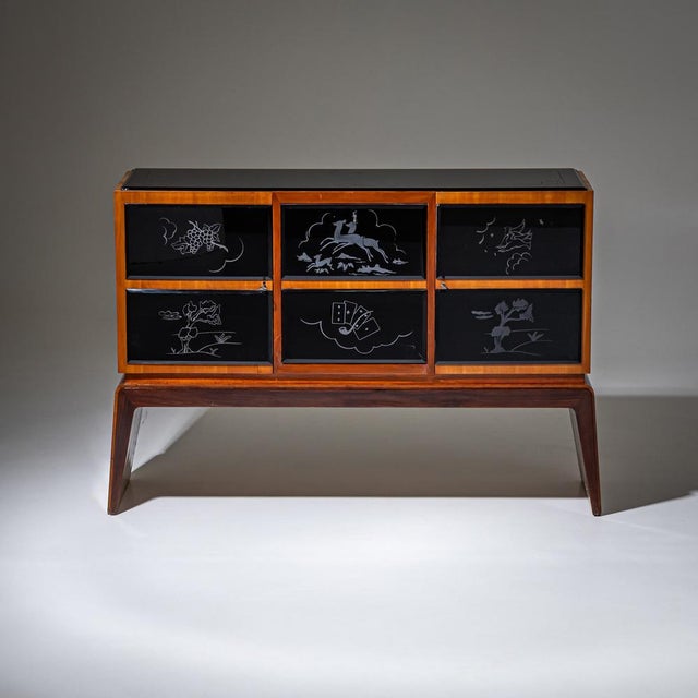 Bar Cabinet standing on two legs with three drawers and a glass top, the middle tor folds down. The interior is completely...