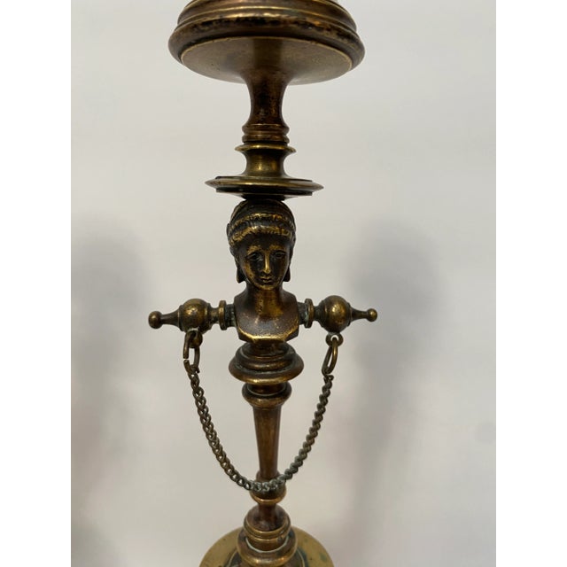 Pair of antique Greek Neoclassical Revival candlesticks with the bust of a mythological lady. Unmarked.