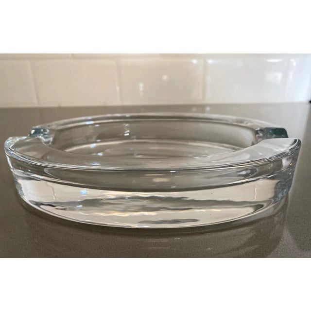 Heavy clear glass oval shaped ashtray with 2 rests. Great addition to coffee table or use for candles/incense.