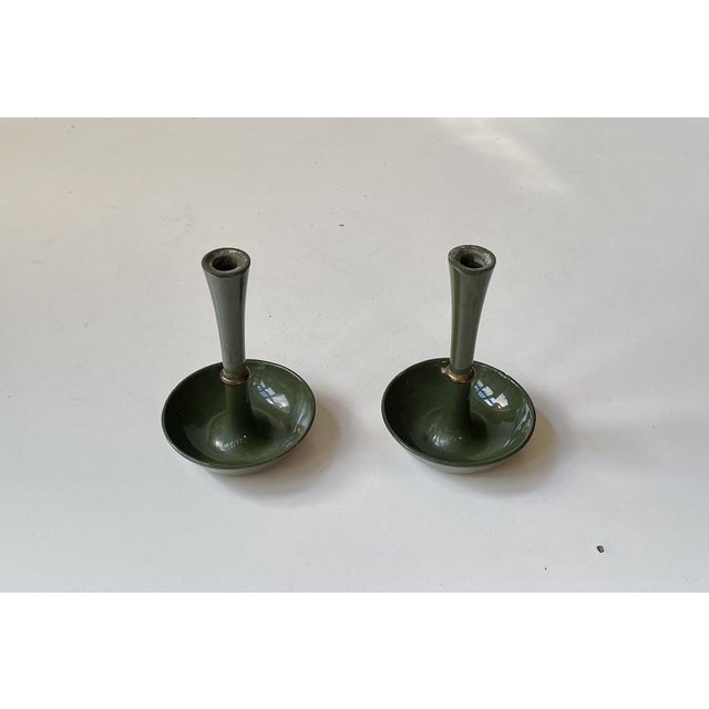 A rare set of candlestick holders for tapered/ candles. Designed by the Industrial Danish design icon Jens Harald...