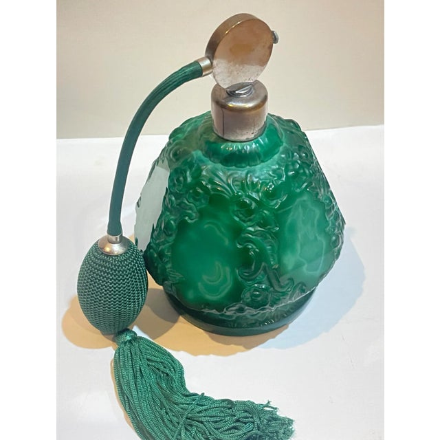 Ca. 1930s art deco atomizer perfume bottle, made of Czechoslovakian malachite glass crystal. A hand crafted, mold blown...