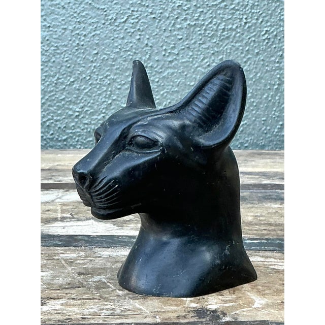 Exude an air of ancient mystery and modern sophistication with this striking vintage cast metal cat head bust. Influenced...