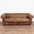 The brown vintage leather creates the appeal in this handsome Chesterfield sofa. The impressive tufted back with large,...