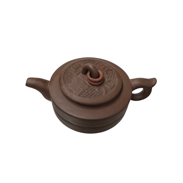 Experience the time-honored tradition of Chinese tea with our authentic Yixing Zisha clay teapot, a true masterpiece for...
