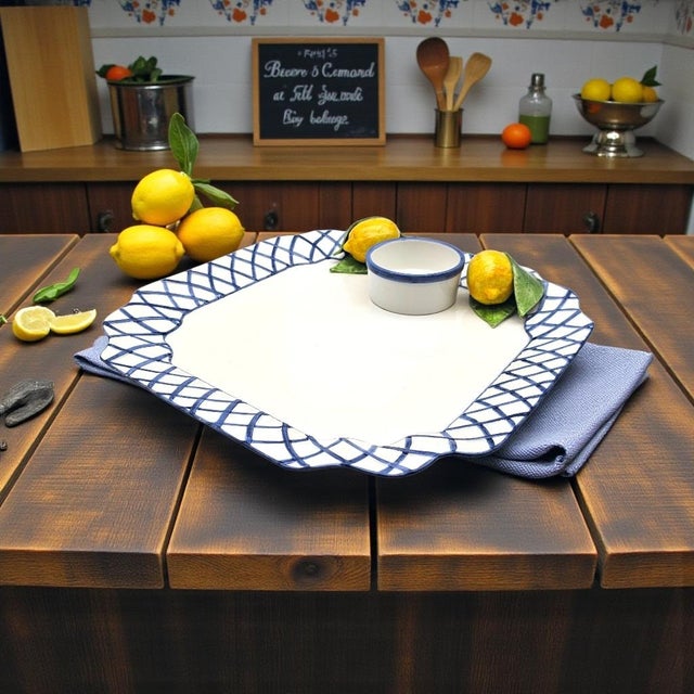 This handcrafted Italian ceramic chip and dip platter is produced by The Manelion and finished in the Blue Trellis with...