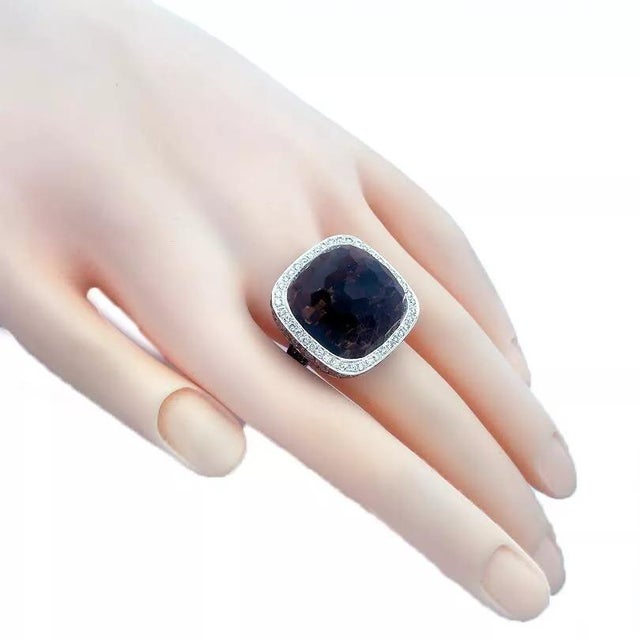 This is a large, beautiful cocktail ring, it is crafted from 18k white gold with black rhodium. The top feature a large...