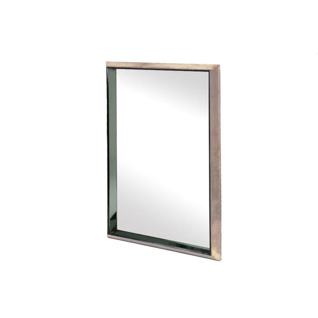 Max Ingrand for Fontana Arte. Mirror in polished and colored metal, rectangular in shape. Italian work realized in the...