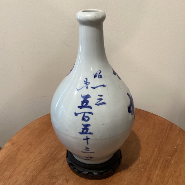 Japanese Antique Japanese Tokkuri (Sake Long Neck Bottle) W/ Blue Underglaze Calligraphy on Wood Base For Sale - Image 3 of 12