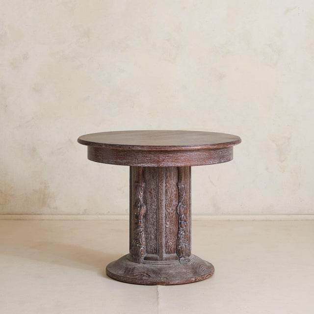 Sourced in Paris, this French center table from the 1940s speaks in texture and proportion Crafted in cerused oak, the...