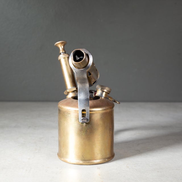 ABOUT An antique solid brass plumber's blowtorch with a perforated handle. Stamped "Primus Sweden". Shown with life size...