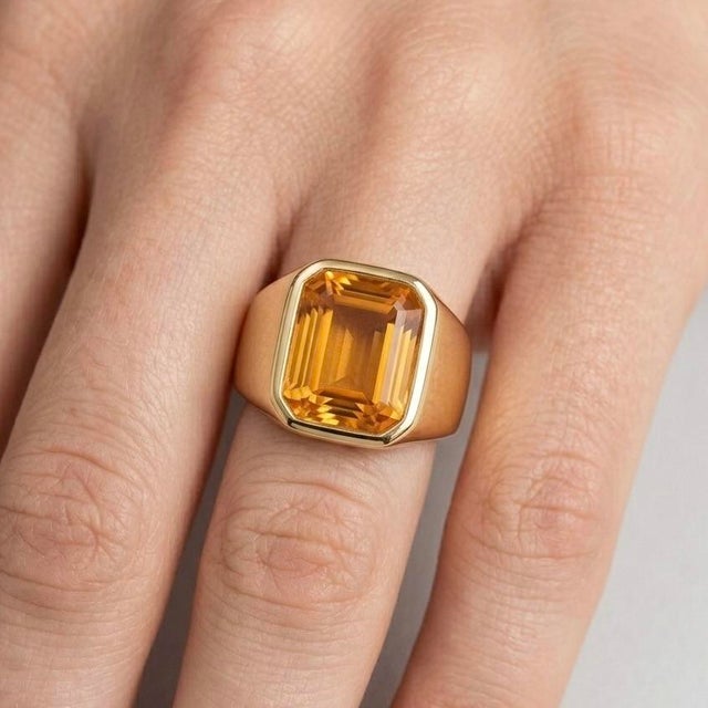 Make a bold statement with this striking gemstone ring, designed with a perfect balance of modern sophistication and...