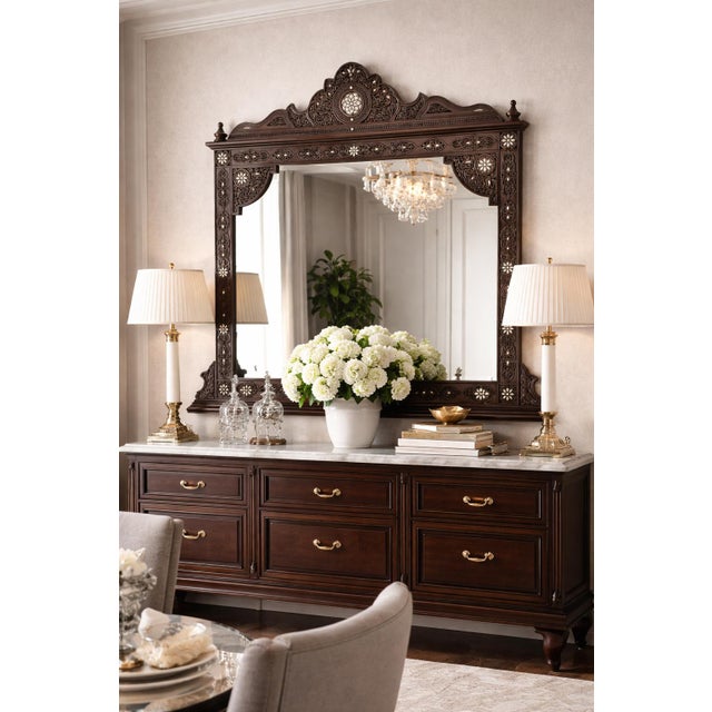 This Moorish style vanity mirror made of solid walnut wood and inlaid with mother-of-pearl. Intricately and finely hand-...