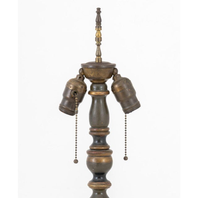 Neoclassical Style Ebonized and Giltwood Floor Lamp, with foliate design on circular base. 61" H x 10" Diameter....