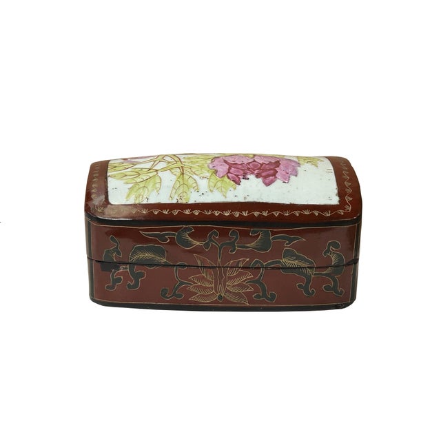 This is a handmade wood box in an irregular shape with an old white base pink flower graphic porcelain part inset on the...