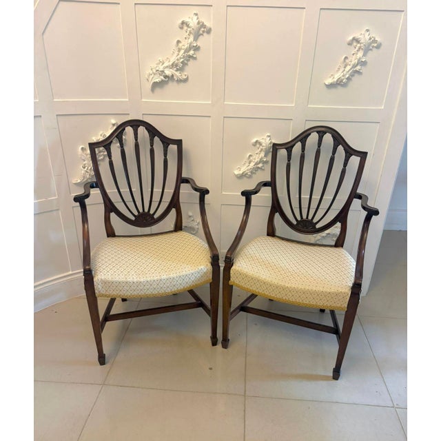 A superb quality set of 10 antique Edwardian mahogany shield back dining chairs by the renowned London makers Maple & Co...