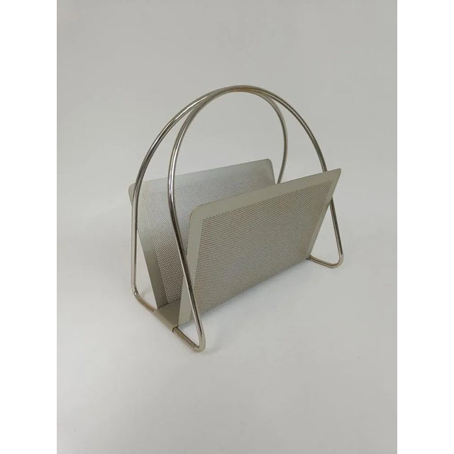 Vintage Italian design magazine rack / newspaper rack from the 80s with a metal frame made by Mascagni. This piece is...
