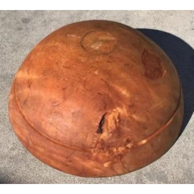 This very large butter bowl was found in New England. It has a burl look to it but it is pine. The condition is very good.