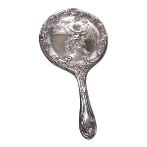 Silverplated Hand Mirror Decorated With a Cherub