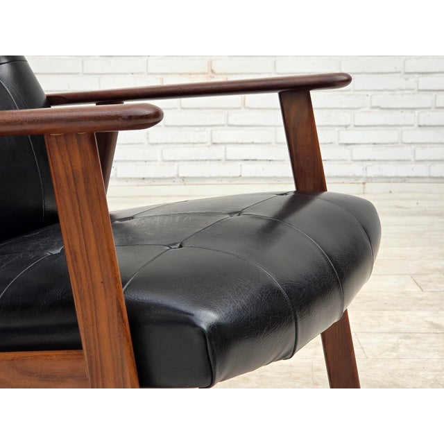 1970s, Danish armchair. Black artificial leather, teak wood legs and armrests. Original good condition: no smells, no...