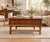 Beautiful mid-century coffee table by Lane Furniture, featuring a center drawer with brass drawer pulls, tapered legs with...