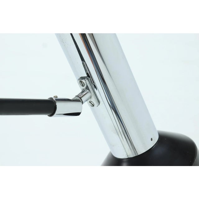 Large adjustable desk lamp from the 1960s. The lamp is adjustable in height and the shade can be positioned in many ways....