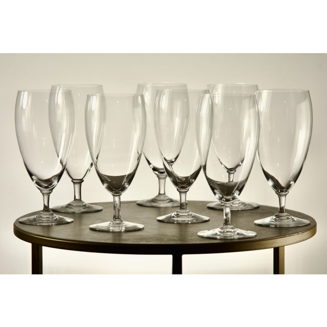 A set of eight French water crystal goblets by Baccarat, each signed on the underside of the foot with the acid-etched...
