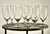 A set of eight French water crystal goblets by Baccarat, each signed on the underside of the foot with the acid-etched...