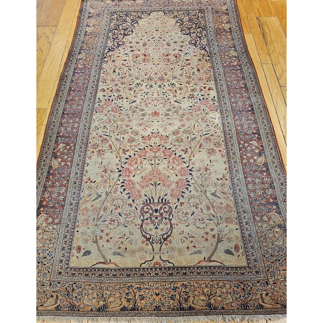 "The 19th century Persian Kashan library rug with a Vase “Tree of Life” design with birds on branches elevating towards...