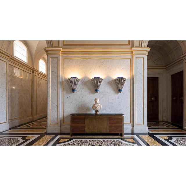 1.423 a refined set of three large art deco wall lamps. Crafted by cs arte in florence, these sconces are distinguished by...