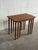 This set of three nesting tables features a versatile and space-saving tiered design. Slender tapered legs and clean lines...