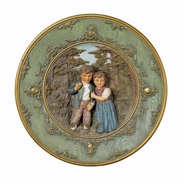 Terracotta Wall Plate with Whimsy Children in Farmer Costumes by Johann Maresch. A large terracotta wall plate depicting a...
