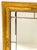 A very appealing decorative French Empire style mirror with applied decorative elements and a gilt type finish. A solid...