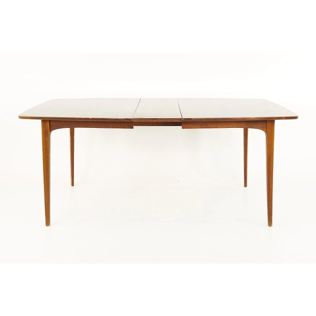 Kent Coffey Perspecta Mid Century Walnut Surfboard Dining Table This table measures: 60 wide x 42 deep x 29.5 inches high,...