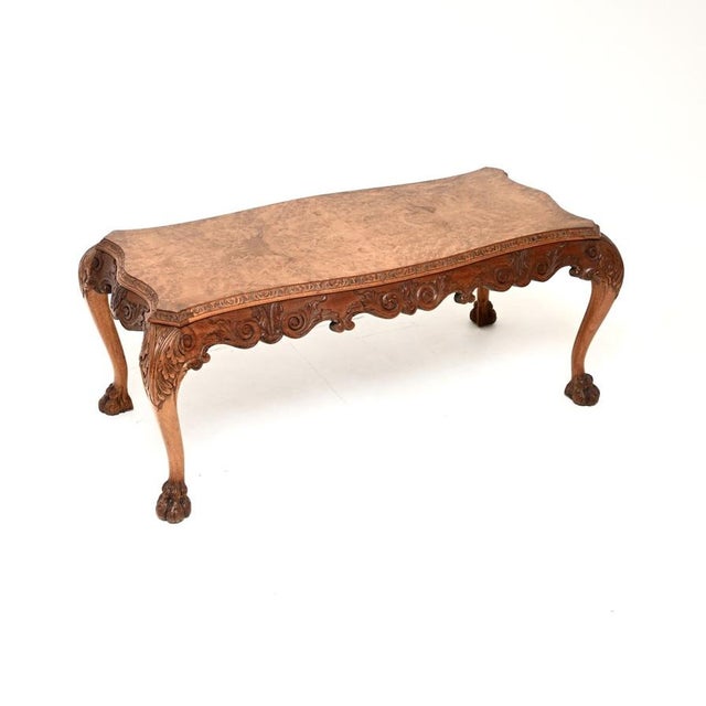 A stunning antique Queen Anne style burr walnut coffee table. This was made in England, it dates from around the 1920’s....