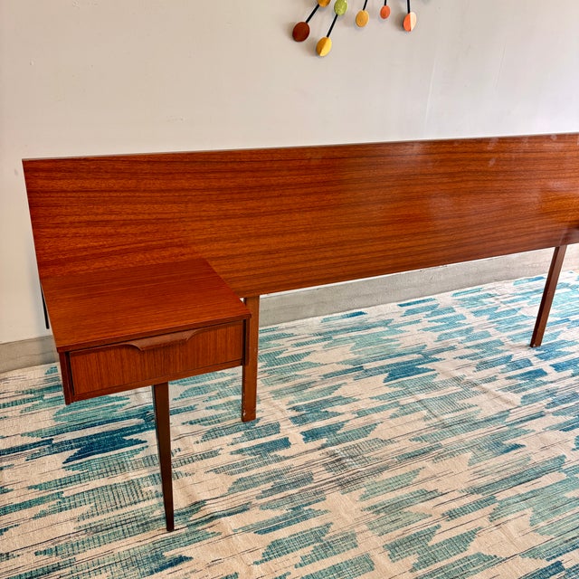 Striking mid-century modern queen headboard by Austinsuite (Stamped ‘Austinsuite’ , F. Austin & Sons Ltd, London), crafted...