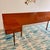 Striking mid-century modern queen headboard by Austinsuite (Stamped ‘Austinsuite’ , F. Austin & Sons Ltd, London), crafted...