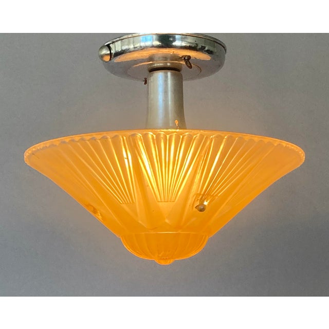Offering a really nice little flush-mount fixture from the Roaring Twenties (maybe the 30s). The solid aluminum apparatus...