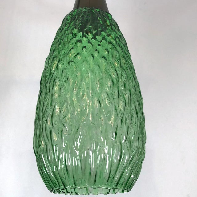 Good vintage condition with traces of age and use. This set of two pendant lamps was produced in Italy during the 60s and...