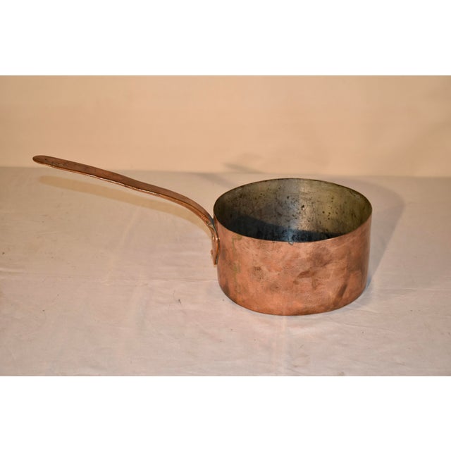 19th century hand made copper pot from France. The pot is hand made and dovetailed construction with brass. The interior...