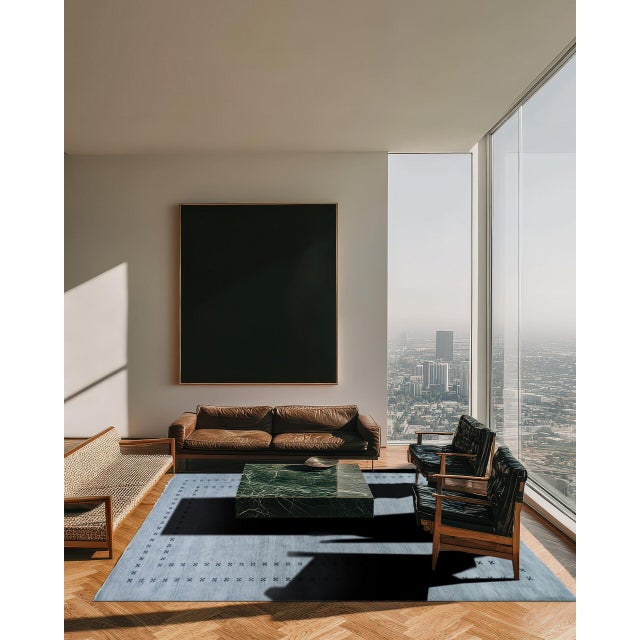 Jasmine Alluring Gray Handmade Wool Rug, Country of Origin: India. This exquisite piece defines contemporary elegance...