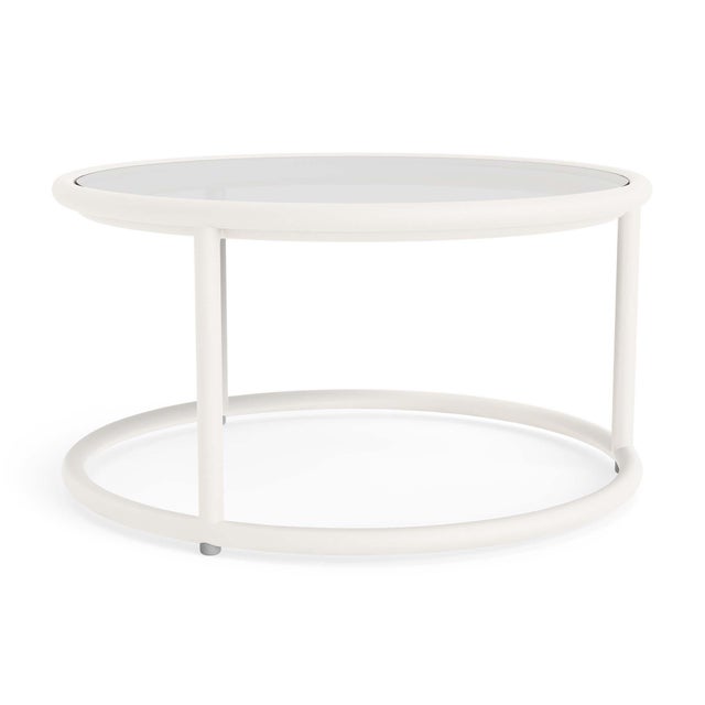 A free flowing frame design and transitional glass tabletop define the Walter Lamb Aluminum 20" Round Occasional Table....