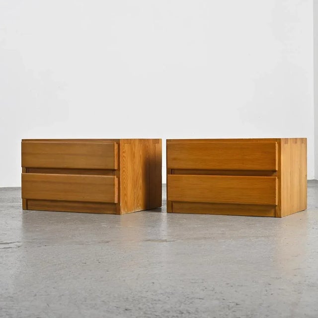Pair of two-drawer bedside tables, designed by Maison Regain, circa 1970. Made entirely of solid pine, these bedside...