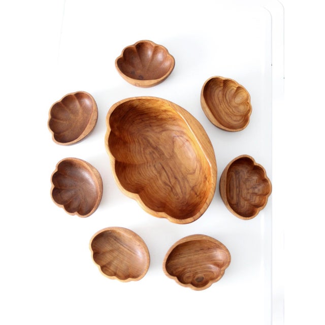 Mid century wood serving bowl set featuring sculptural organic forms with richly varied grain and warm natural wood tones....