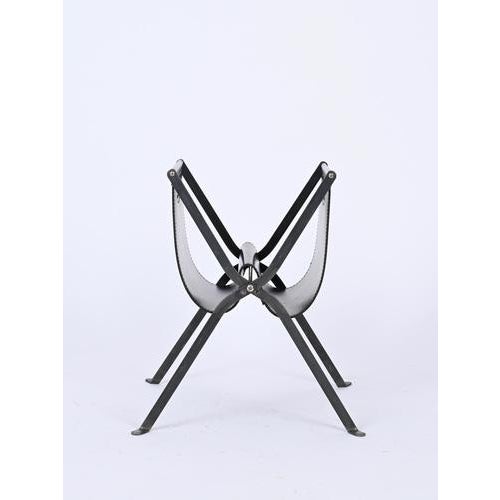 Beautiful folding magazine rack in black leather and iron. This stylish magazine rack was made in Italy during the late...