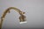 A charming and finely detailed art nouveau style brass desk lamp, combining the graceful arched gooseneck form with an...