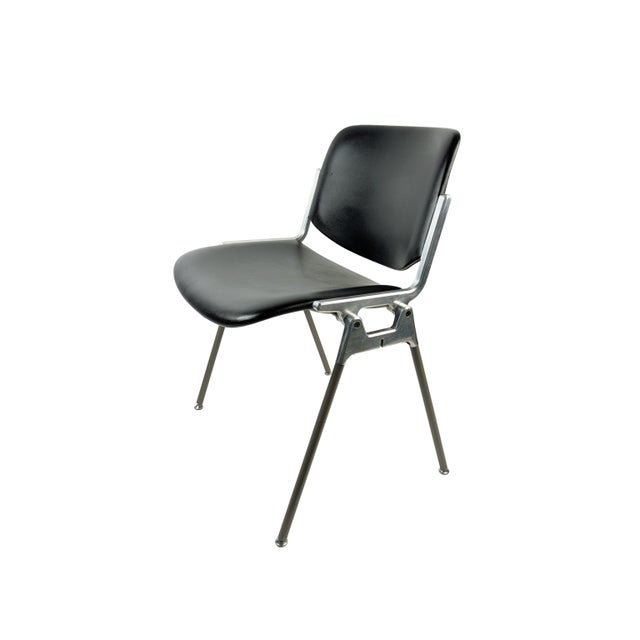 Black skai seat and back, aluminum frame with gray plastic coated legs. Very good condition: few plastic defects at the...