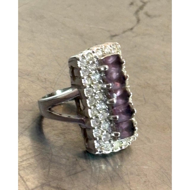 1960s-70s purple/clean rhinestone & silver tone metal large stacked cocktail ring. Excellent condition.