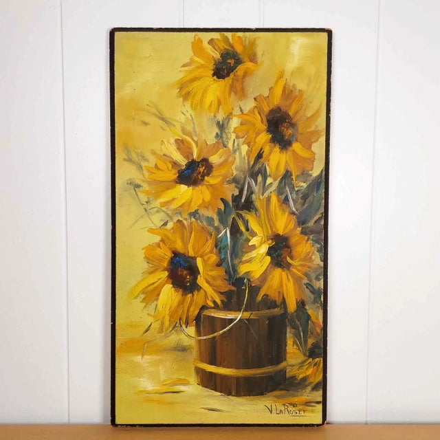 On offer is this lovely, original vintage still life painting. Bright and bold sunflowers in shades of yellow sit in a...