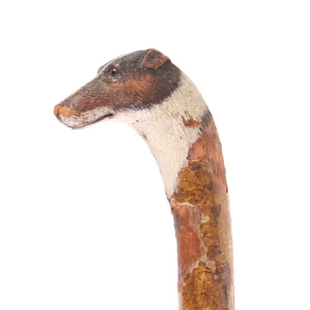 Highly collectible folk art walking cane with dog head painted handle.Very artful painting of dog with pricise detail down...
