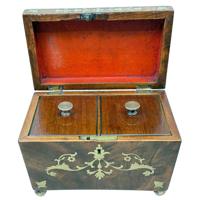 A Very Attractive And Good Quality Regency Mahogany Tea Caddy, Of Sarcophagus Form, Having Profuse Brass Inlaid Foliate...